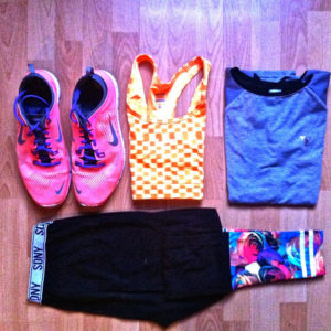 trainers, sports bra, t shirt and leggings folded